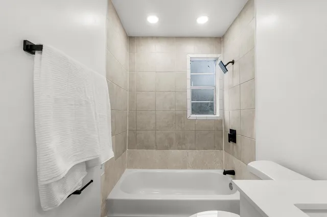 an aerial view of a house with yard swimming pool and outdoor seating