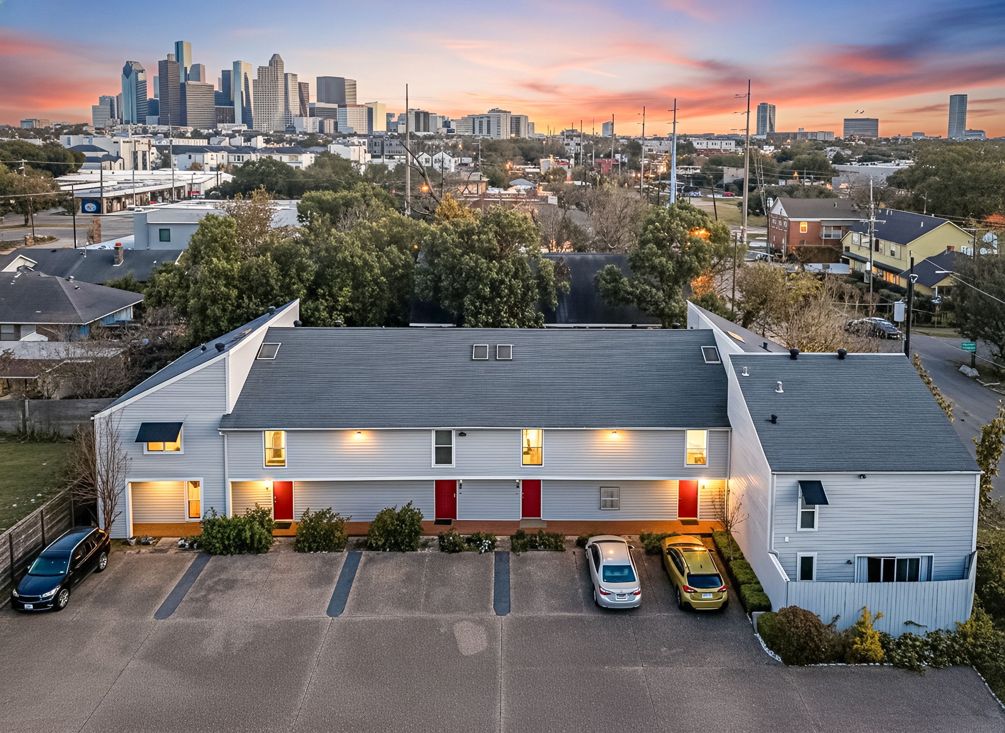 an outdoor space with furniture and a car park in front of it