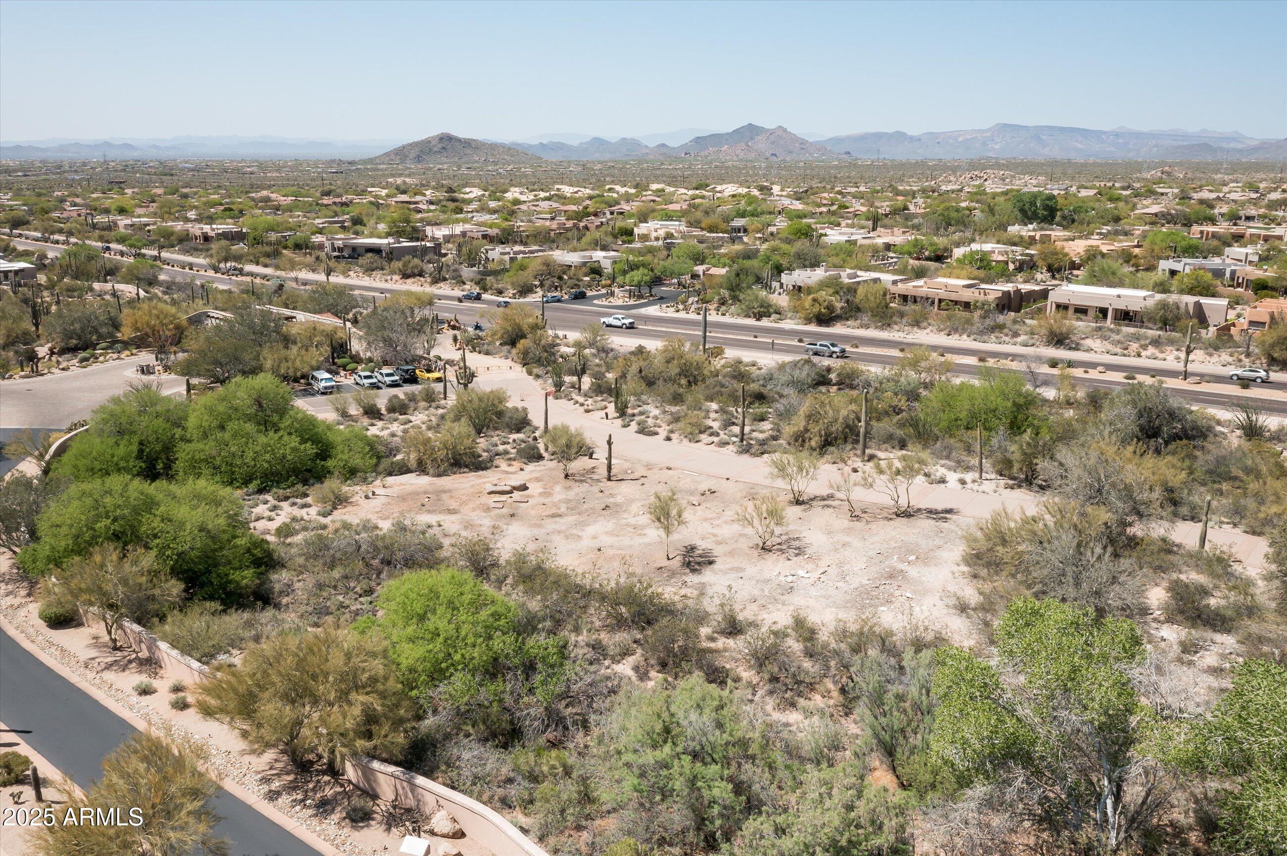 9804 East Running Deer Trail, Unit 1 Scottsdale, AZ 85262 - Photo 8 of 11 an aerial view of residential houses with outdoor space and trees