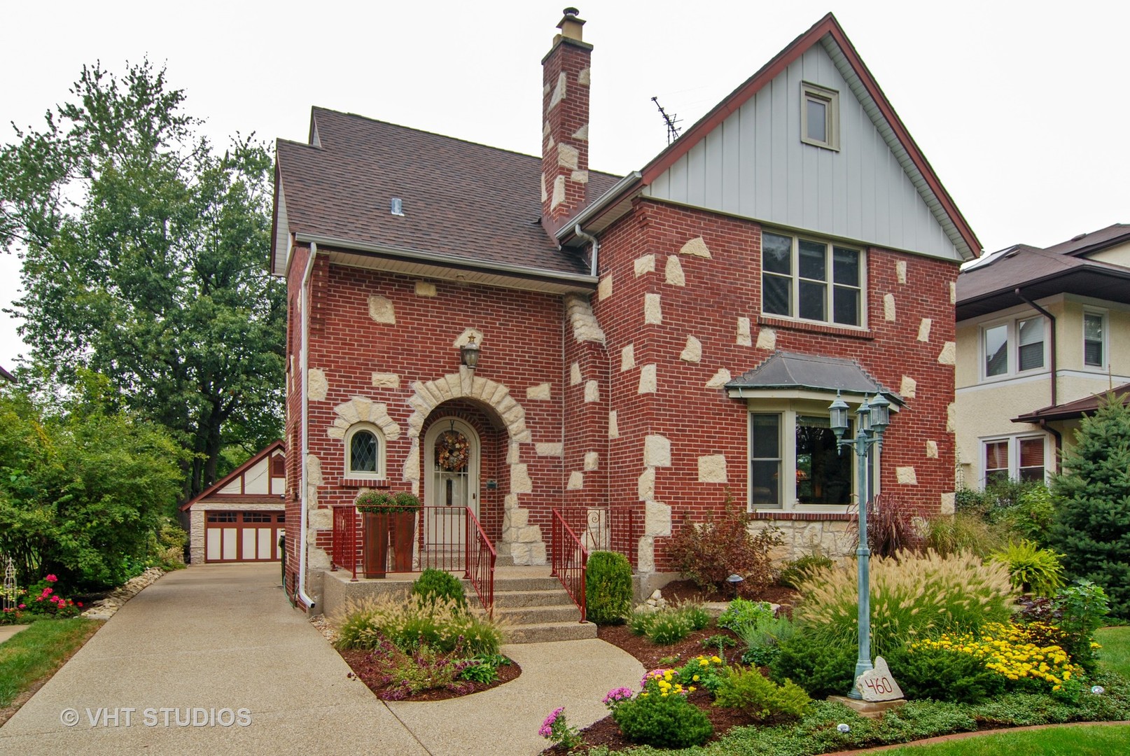 460 Shenstone Road Riverside, IL 60546 - Photo 1 of 23 a front view of a house with garden