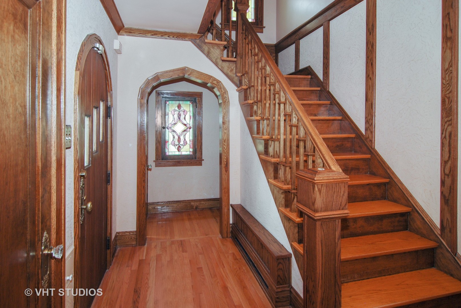 460 Shenstone Road Riverside, IL 60546 - Photo 2 of 23 a view of staircase with wooden floor and a front door