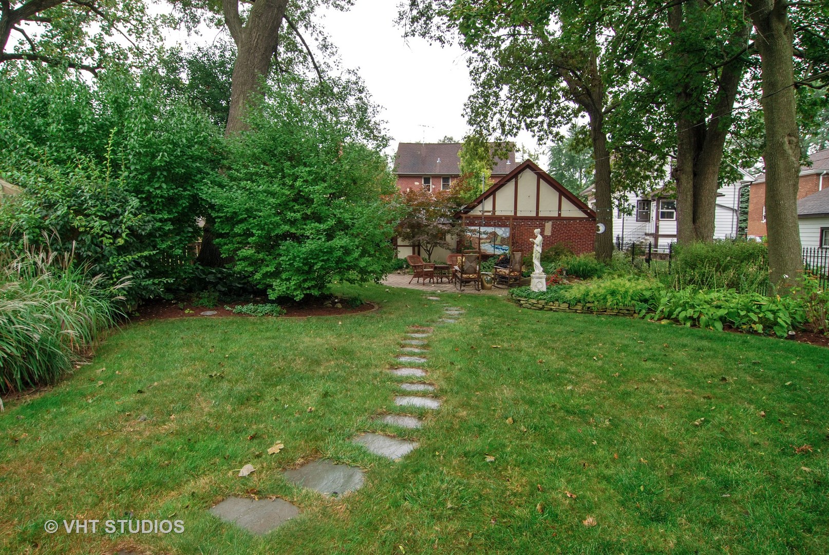 460 Shenstone Road Riverside, IL 60546 - Photo 16 of 23 a house view with a garden space