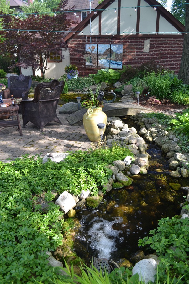 460 Shenstone Road Riverside, IL 60546 - Photo 17 of 23 a backyard of a house with a yard and outdoor seating