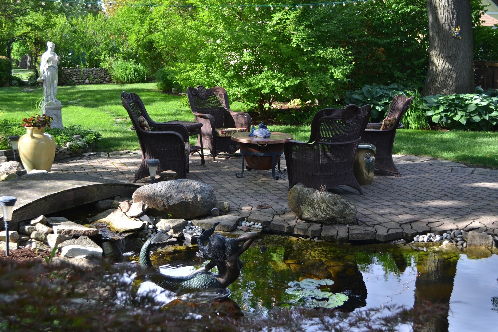 460 Shenstone Road Riverside, IL 60546 - Photo 19 of 23 a view of a chairs and fire pit in a yard