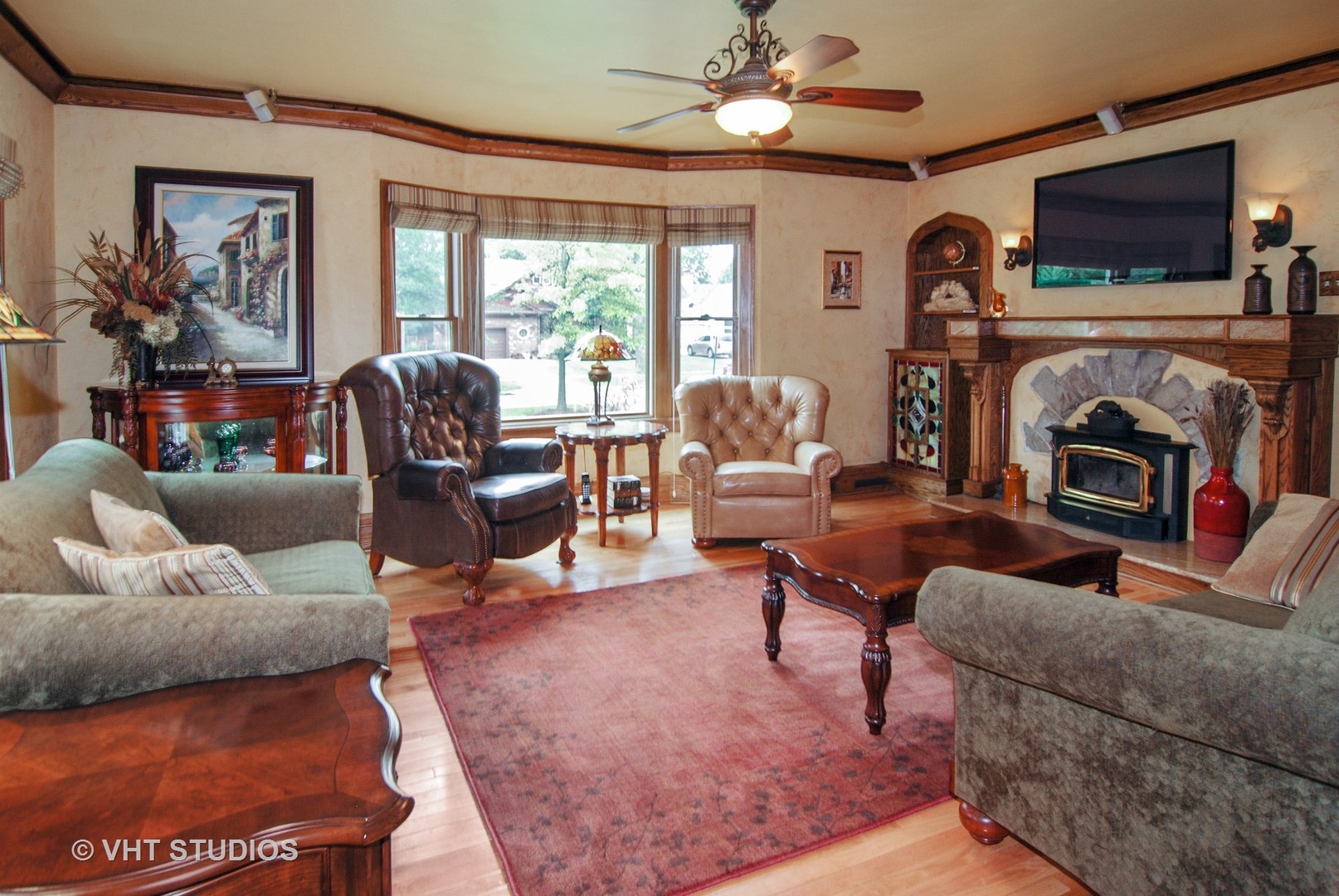 460 Shenstone Road Riverside, IL 60546 - Photo 3 of 23 a living room with furniture a flat screen tv and a fireplace