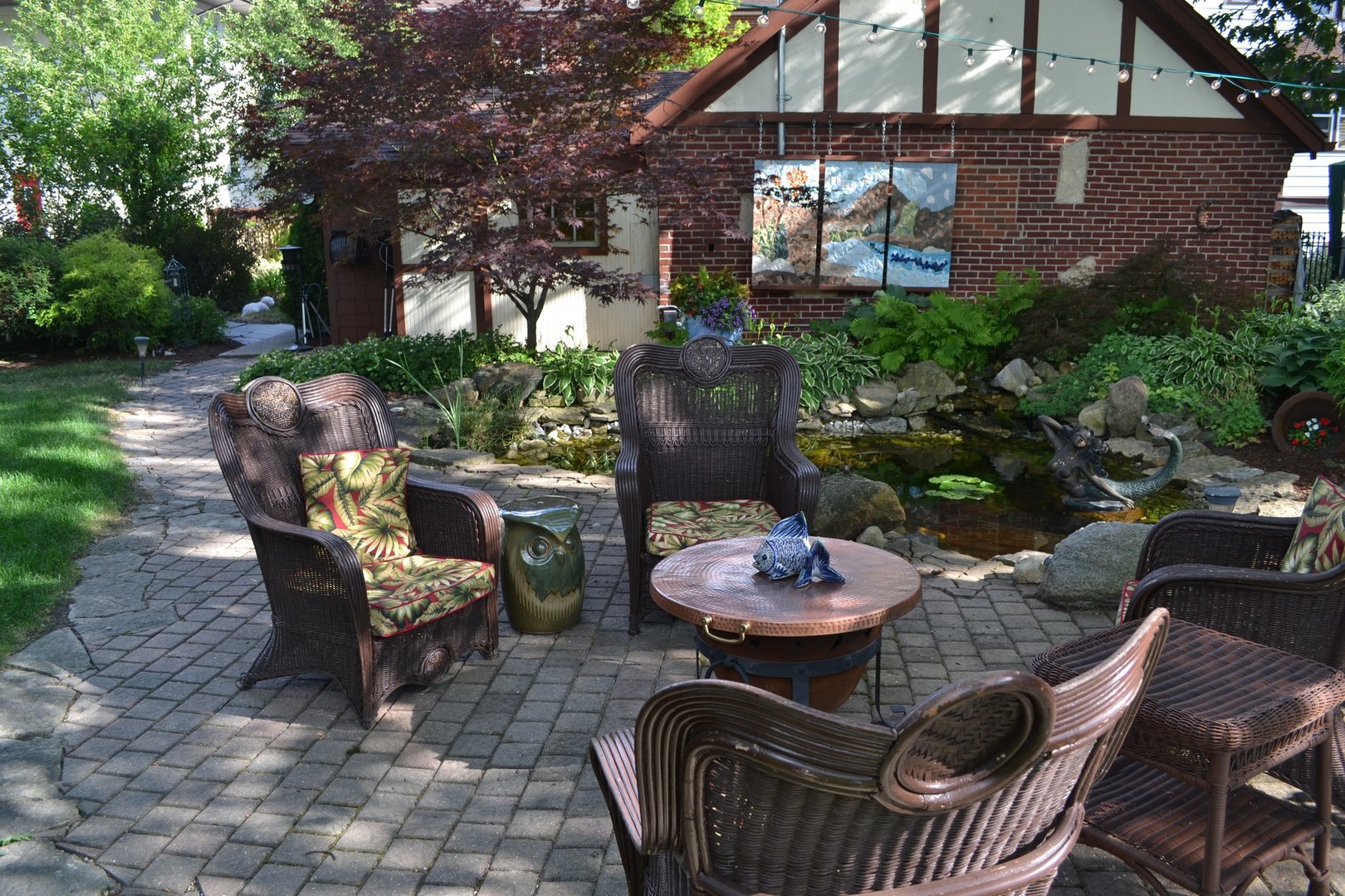 460 Shenstone Road Riverside, IL 60546 - Photo 21 of 23 a patio with a table and chairs and a fire pit