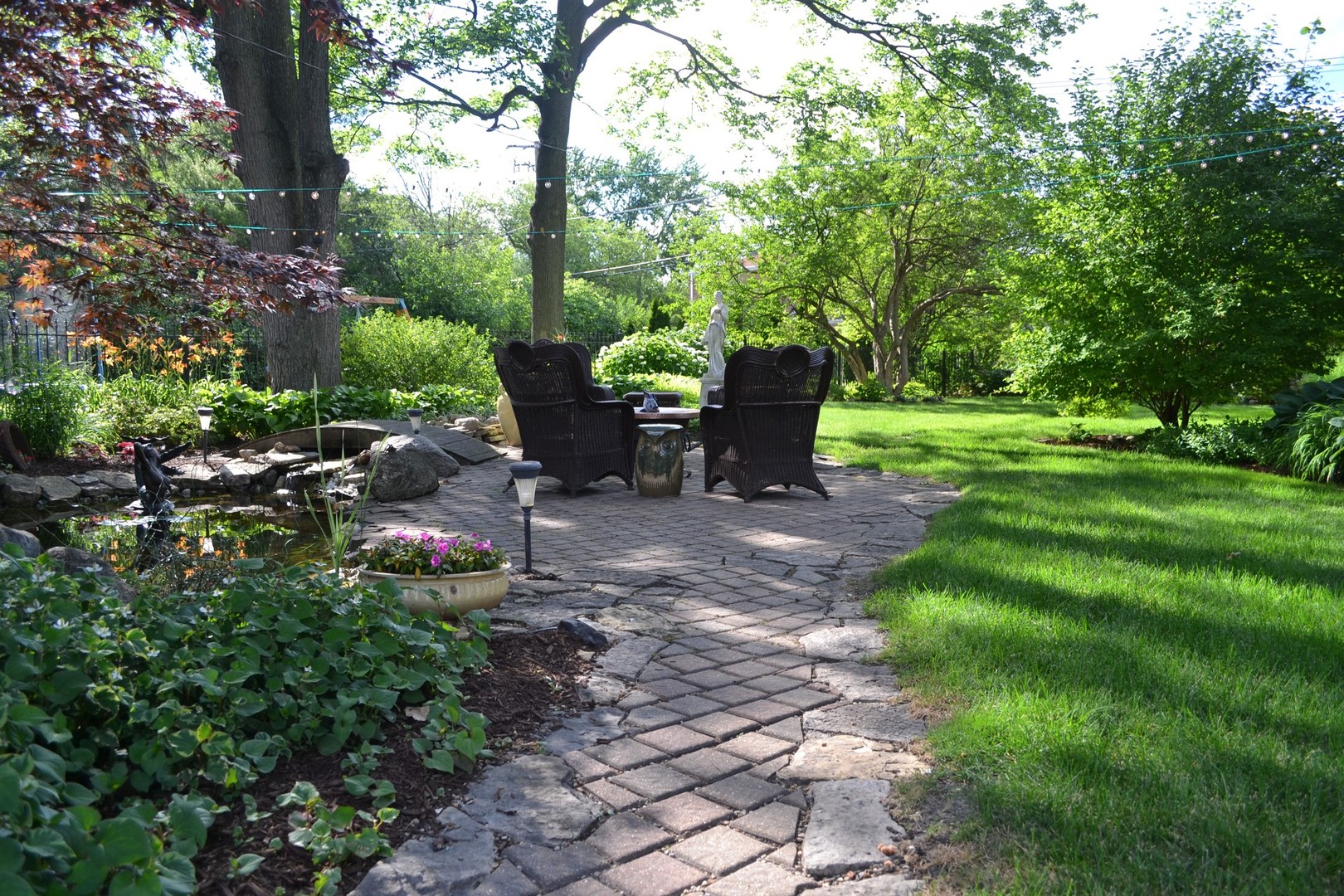 460 Shenstone Road Riverside, IL 60546 - Photo 22 of 23 a view of a chair and table in the garden