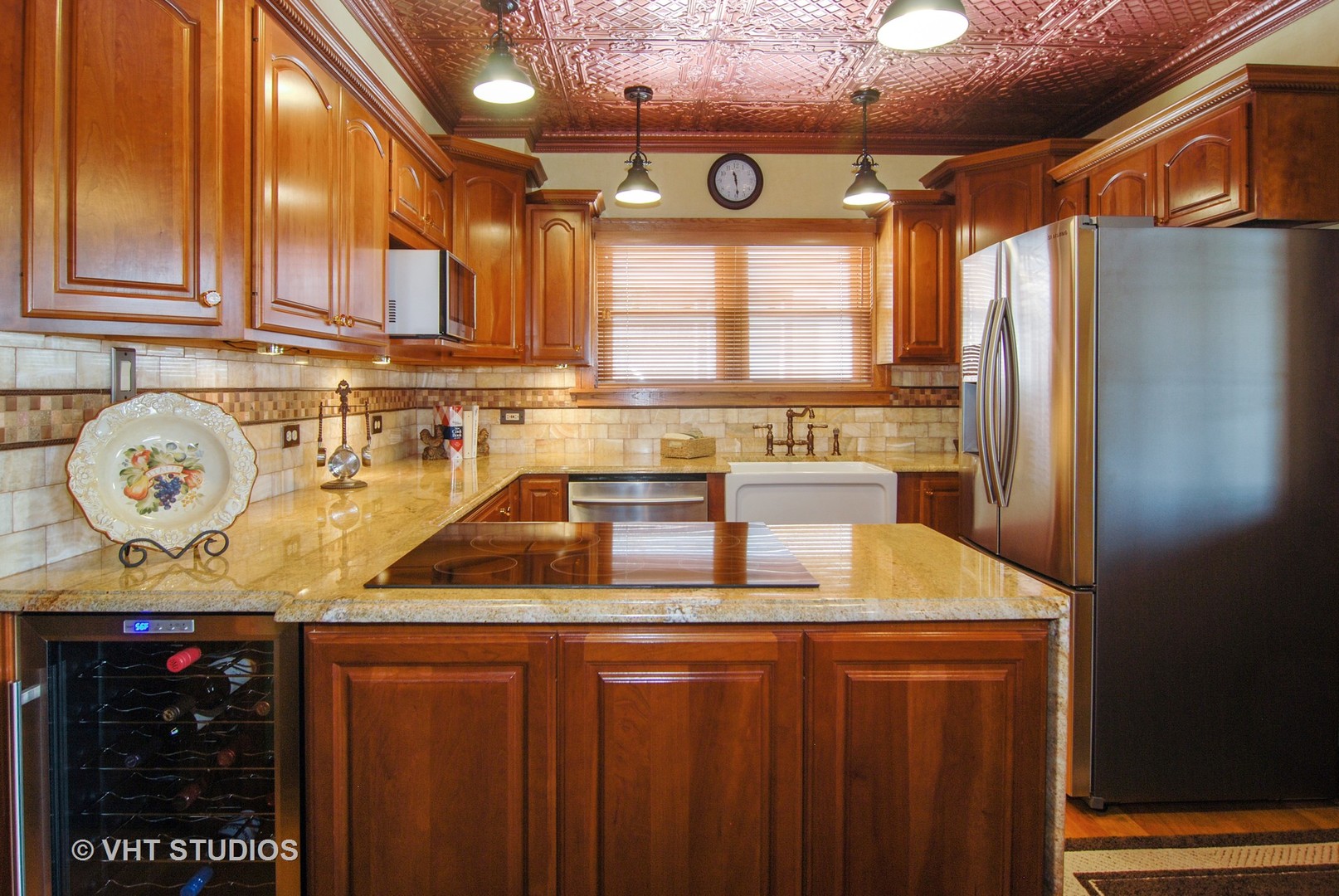 460 Shenstone Road Riverside, IL 60546 - Photo 7 of 23 a kitchen with stainless steel appliances granite countertop a sink a stove and a refrigerator