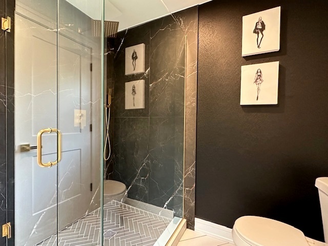 906 Revere Road Glenview, IL 60025 - Photo 20 of 32 a bathroom with a shower toilet and sink