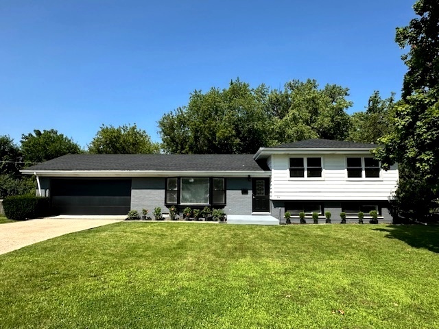 906 Revere Road Glenview, IL 60025 - Photo 2 of 32 a front view of a house with garden