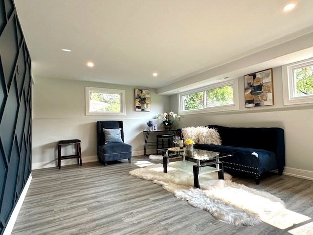 906 Revere Road Glenview, IL 60025 - Photo 22 of 32 a living room with furniture and a fireplace