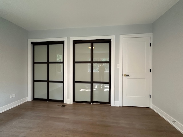 906 Revere Road Glenview, IL 60025 - Photo 23 of 32 an empty room with windows and closet