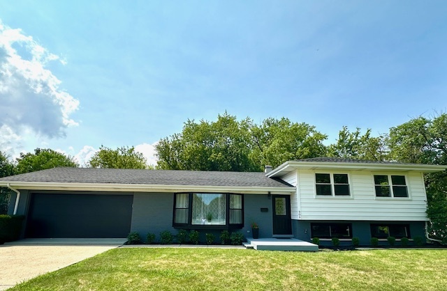 906 Revere Road Glenview, IL 60025 - Photo 32 of 32 a front view of a house with a yard