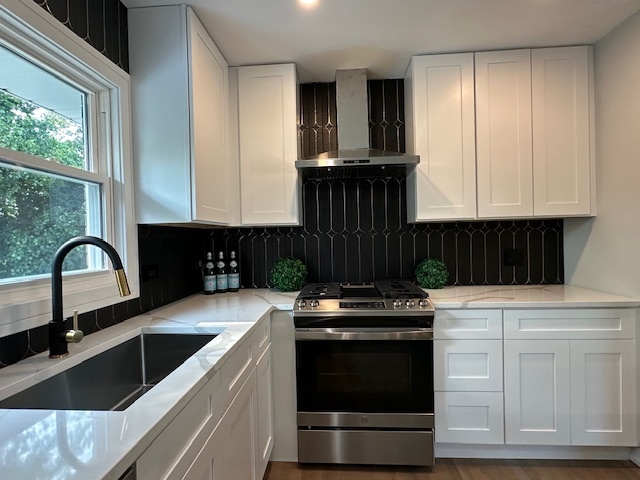 906 Revere Road Glenview, IL 60025 - Photo 5 of 32 a kitchen with a stove and a sink