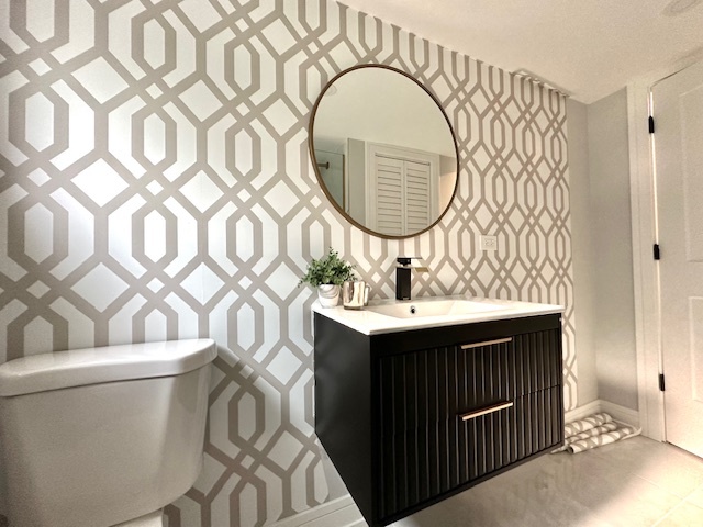 906 Revere Road Glenview, IL 60025 - Photo 10 of 32 a bathroom with a sink a mirror and a toilet