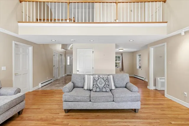 a view of kitchen and dining room with wooden floor