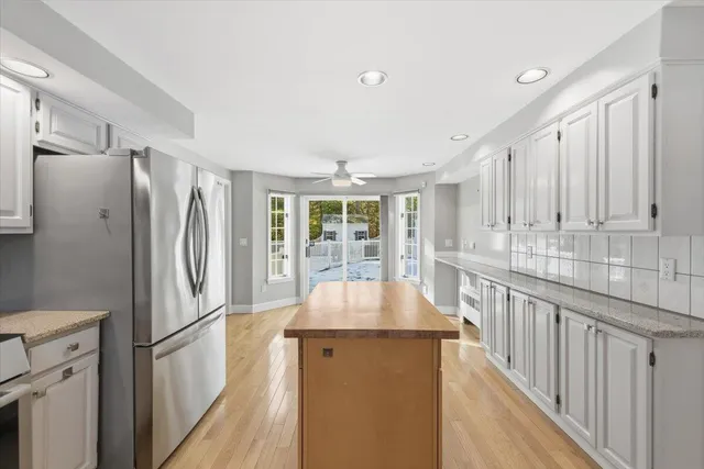 a kitchen with stainless steel appliances a refrigerator and a stove