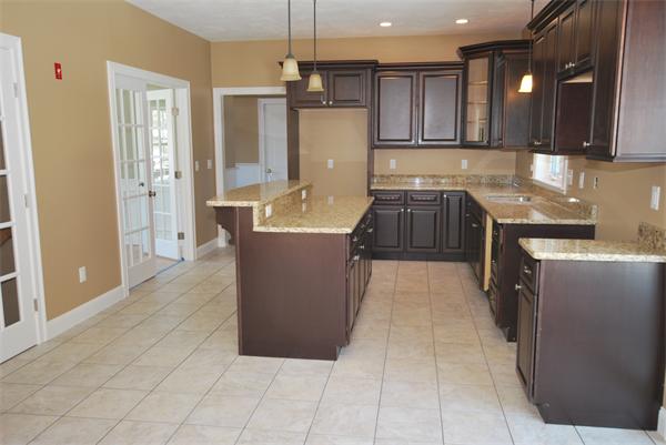 265 Maple Avenue Rutland, MA 01543 - Photo 6 of 13 a large kitchen with a large counter top stainless steel appliances and cabinets