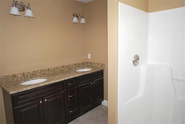 265 Maple Avenue Rutland, MA 01543 - Photo 10 of 13 a bathroom with a granite countertop sink and a mirror
