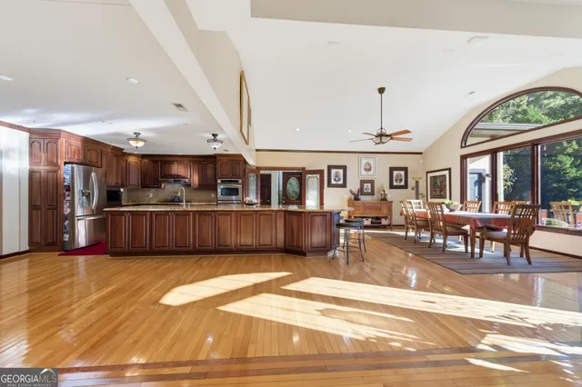 a view of a living room and kitchen