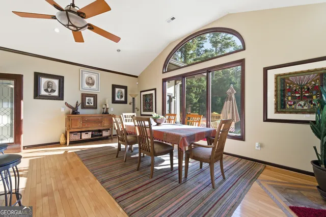 a view of a dining room with furniture window and wooden floor