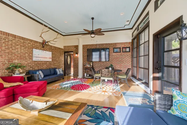 a view of a livingroom with furniture lamp and a chandelier