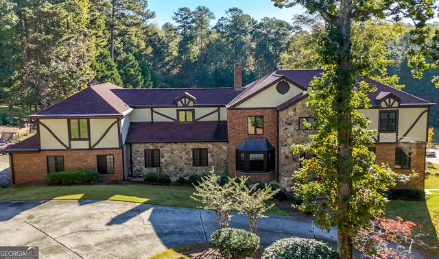 a front view of a house with a yard and table and chair