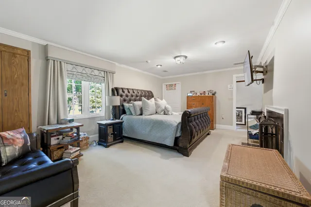 a bedroom with furniture and a window