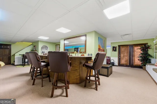 a view of a livingroom with furniture and a window