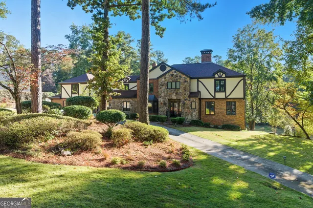 a front view of a house with garden