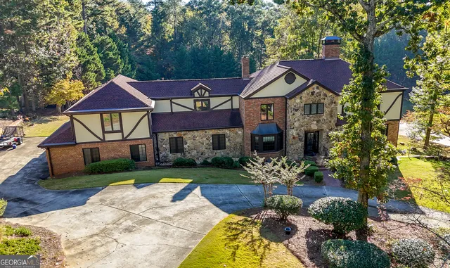 a front view of house with yard and green space
