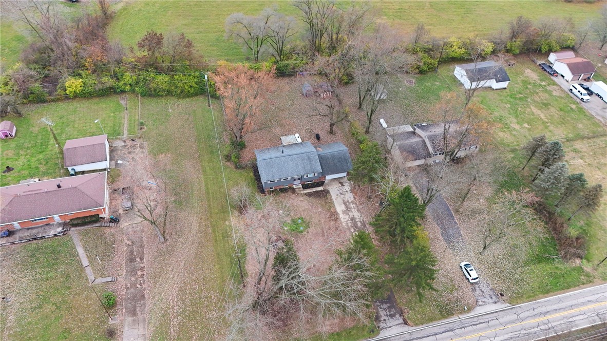 8180 Manning Road Germantown, OH 45327 - Photo 37 of 39 An aerial view showcases a residential property with ample yard space and surrounding greenery.