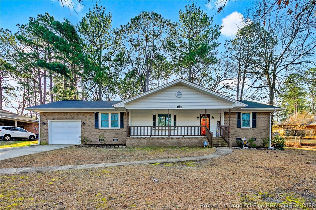 6433 Milford Road Fayetteville, NC 28303 - Photo 1 of 46 a front view of a house with a yard
