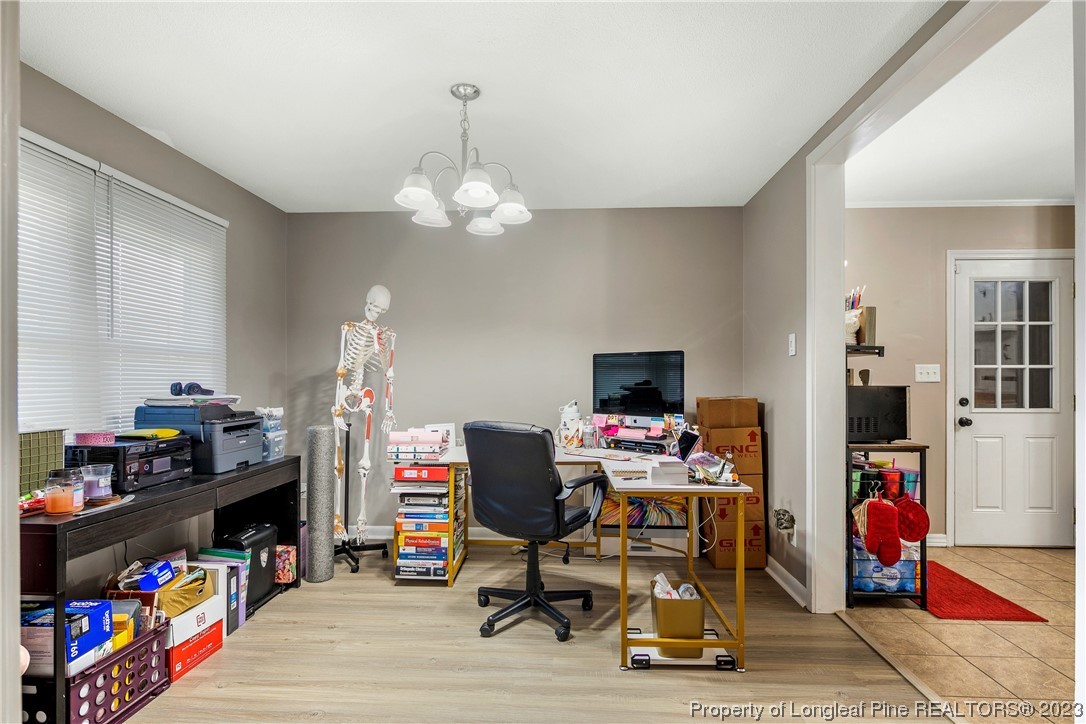 6433 Milford Road Fayetteville, NC 28303 - Photo 14 of 46 a view of a workspace with furniture and toys