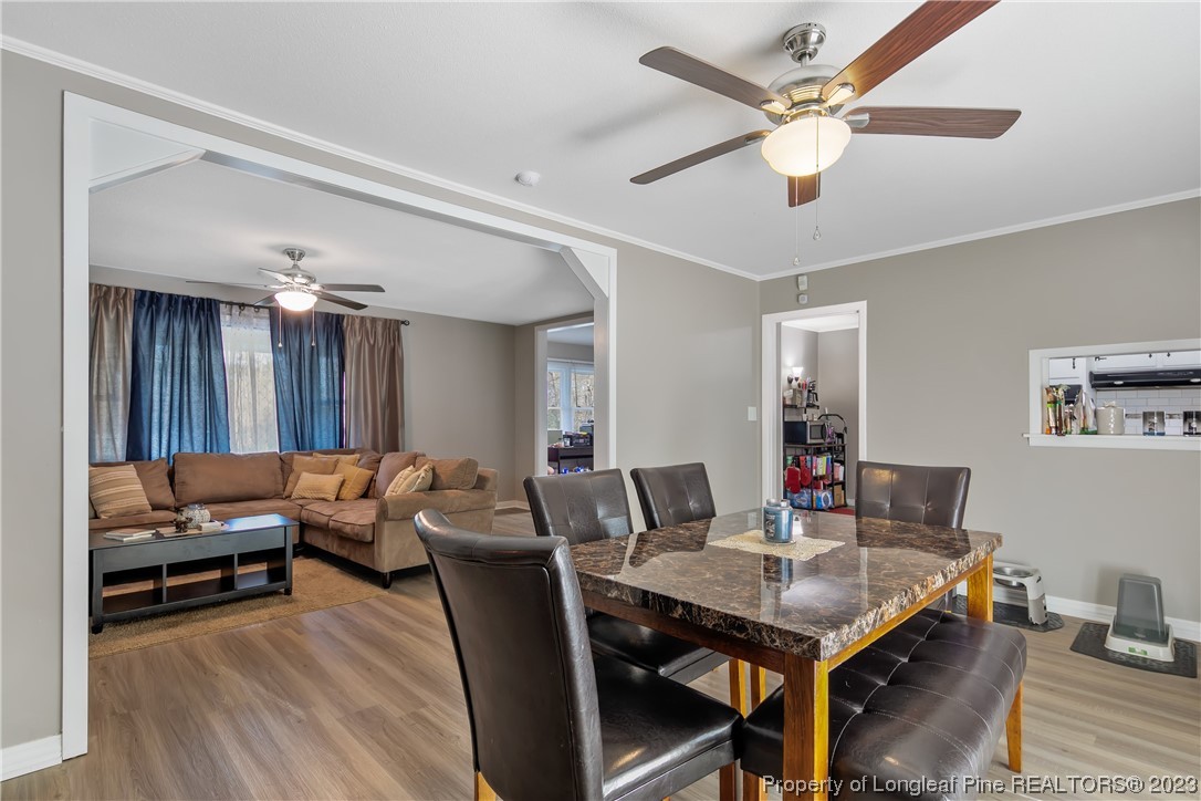 6433 Milford Road Fayetteville, NC 28303 - Photo 26 of 46 a living room with furniture and wooden floor