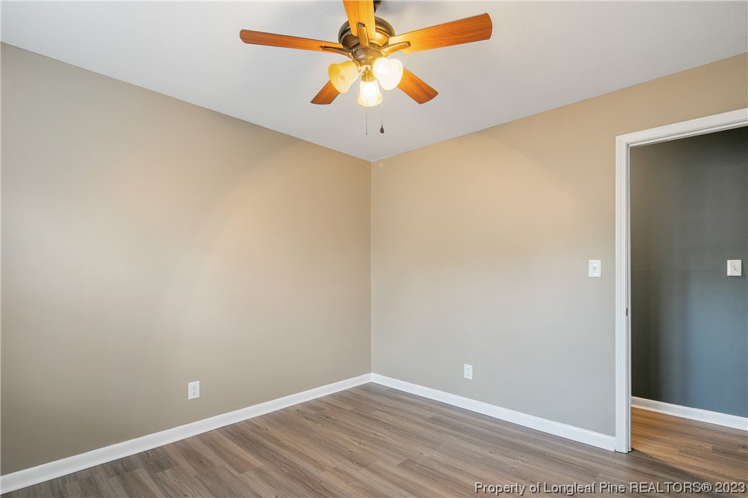 6433 Milford Road Fayetteville, NC 28303 - Photo 40 of 46 wooden floor in an empty room