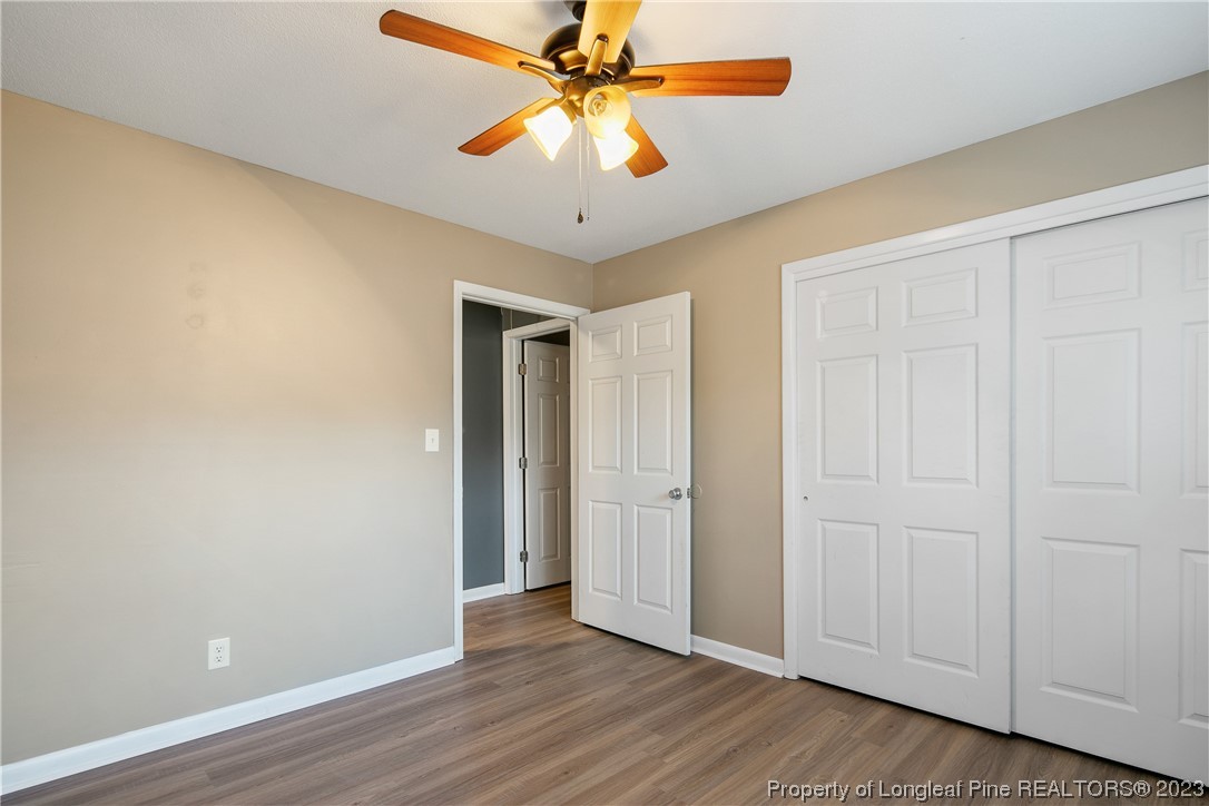 6433 Milford Road Fayetteville, NC 28303 - Photo 41 of 46 wooden floor in an empty room
