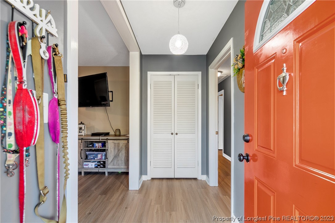 6433 Milford Road Fayetteville, NC 28303 - Photo 5 of 46 a view of walk in closet with clothes and shoes