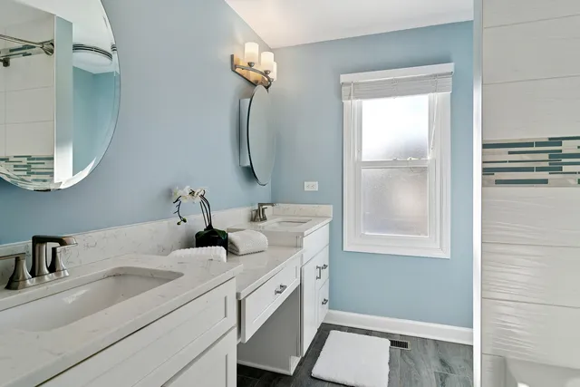 a bathroom with a sink and a mirror