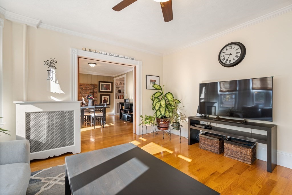 11 Spring Lane Maynard, MA 01754 - Photo 11 of 39 a living room with furniture a flat screen tv and a table