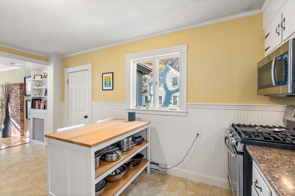 11 Spring Lane Maynard, MA 01754 - Photo 15 of 39 a utility room with a stove a sink and a refrigerator