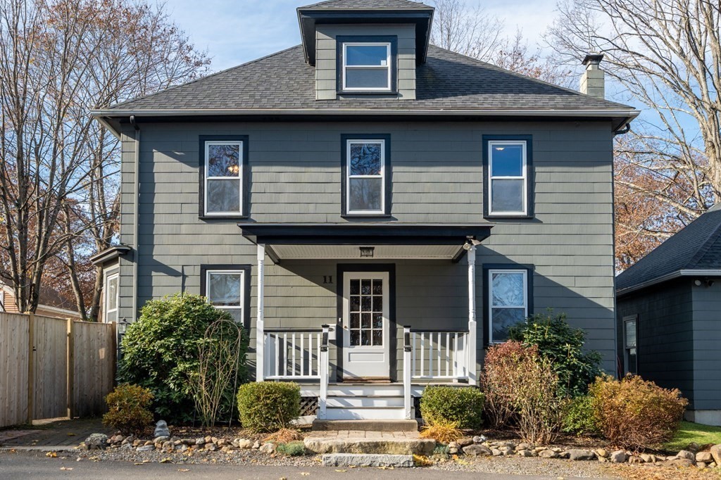 11 Spring Lane Maynard, MA 01754 - Photo 2 of 39 a front view of a house with garden