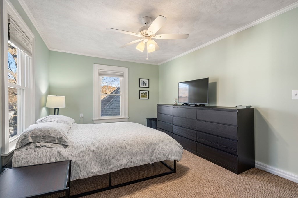 11 Spring Lane Maynard, MA 01754 - Photo 21 of 39 a bedroom with a bed and a flat screen tv