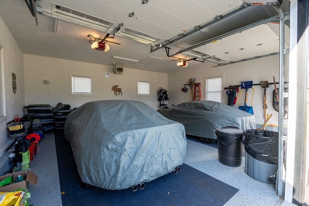 11 Spring Lane Maynard, MA 01754 - Photo 25 of 39 a living room with lots of furniture and gym equipment