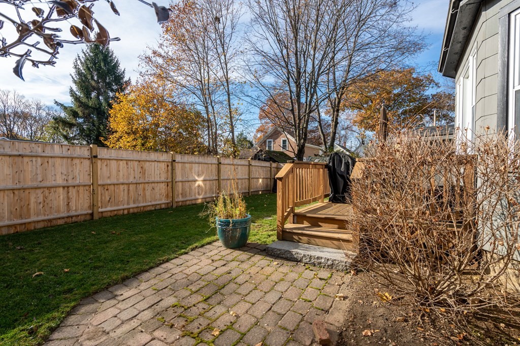 11 Spring Lane Maynard, MA 01754 - Photo 29 of 39 a view of a yard with wooden fence
