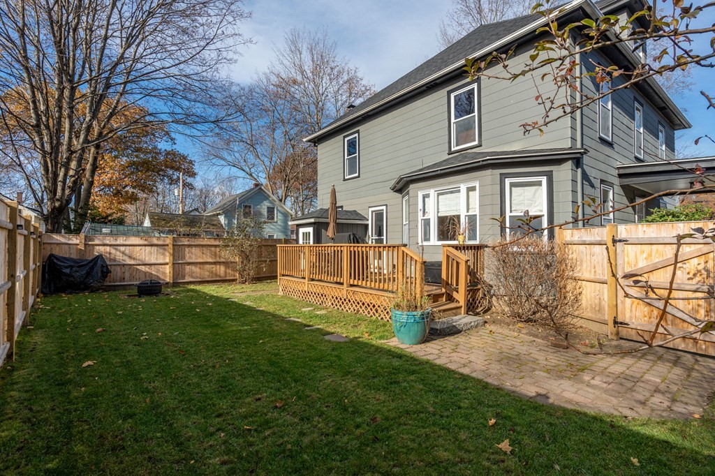 11 Spring Lane Maynard, MA 01754 - Photo 30 of 39 a view of a house with a yard porch and sitting area