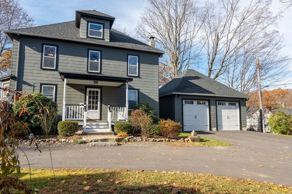 11 Spring Lane Maynard, MA 01754 - Photo 33 of 39 a front view of a house with garden