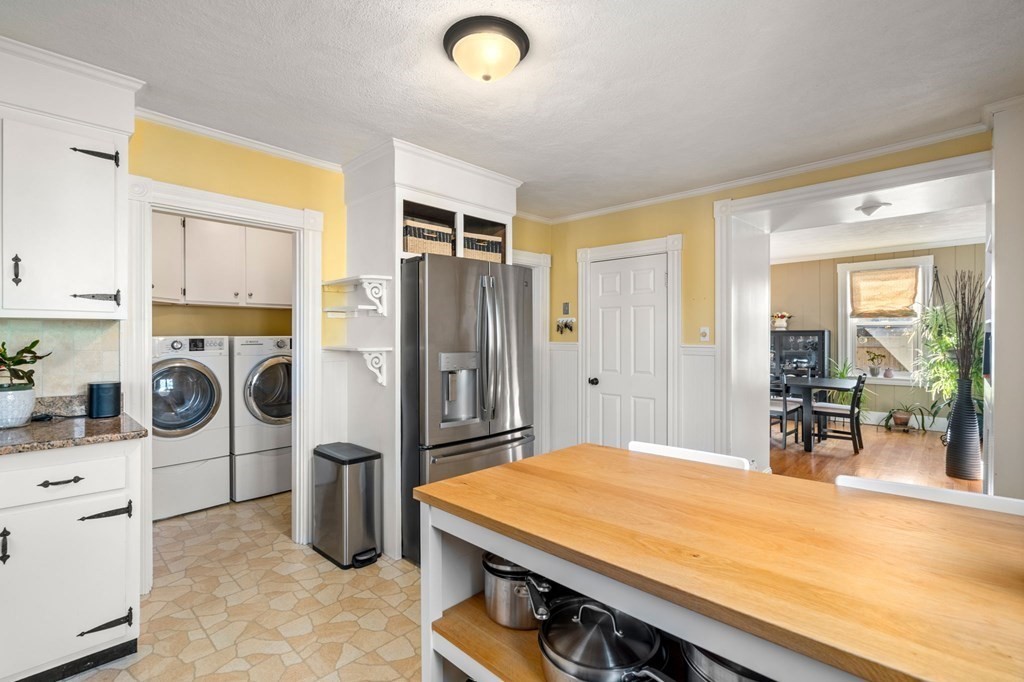 11 Spring Lane Maynard, MA 01754 - Photo 5 of 39 a room with a bed and a stove next to a window