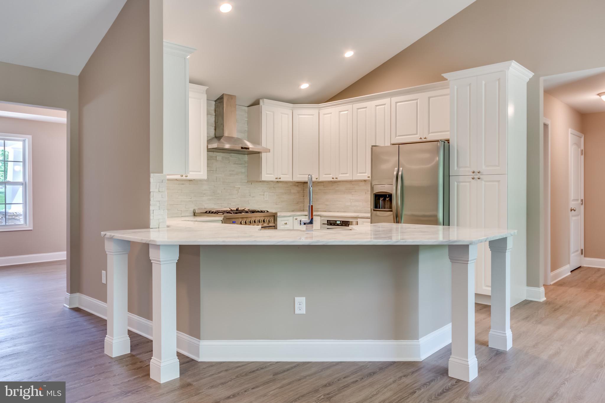 25 Fulton Road Hedgesville, WV 25427 - Photo 12 of 35 a kitchen with stainless steel appliances a sink and cabinets