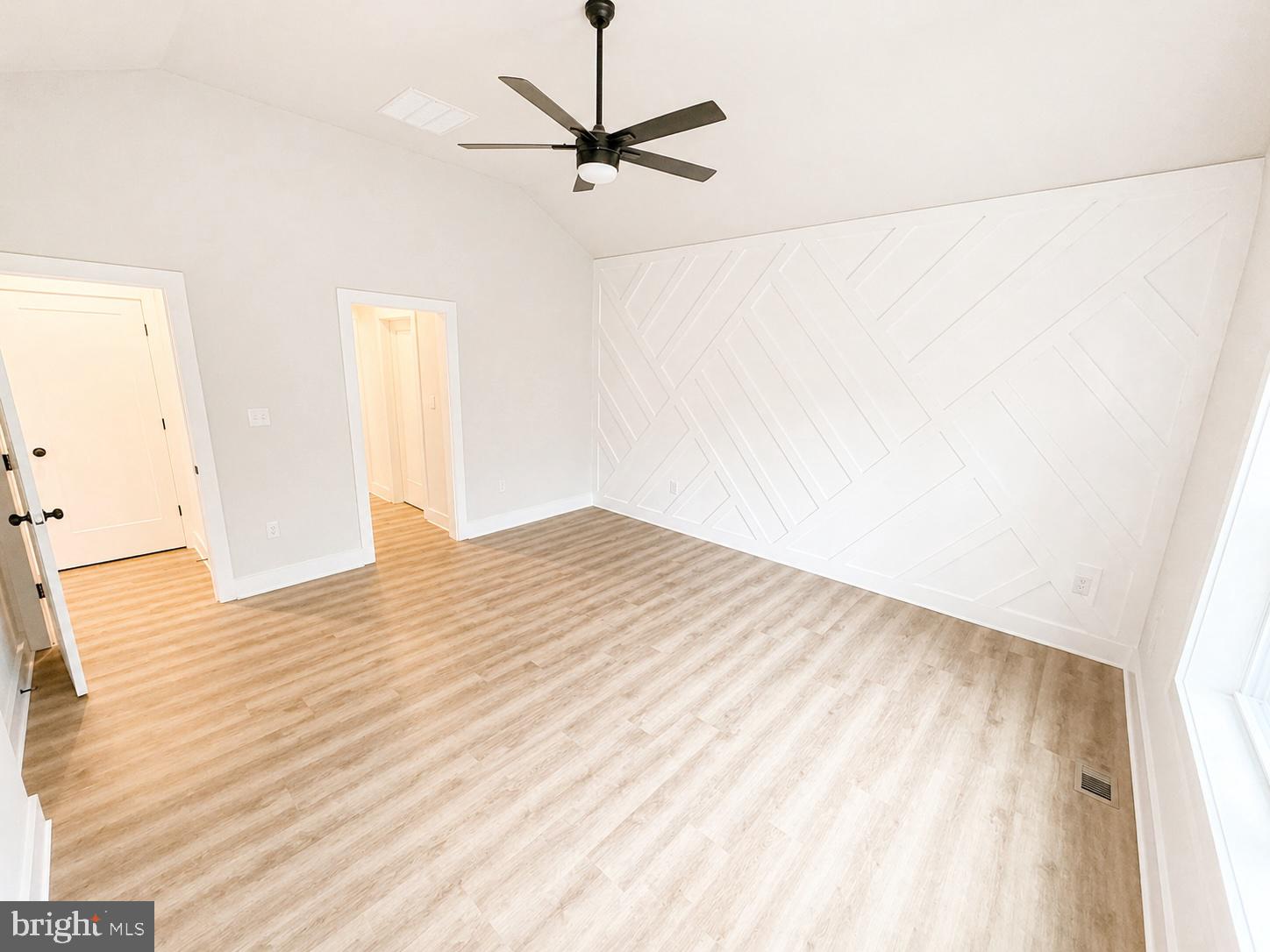 1321 Fulton Road Hedgesville, WV 25427 - Photo 13 of 36 a view of a room with wooden floor and a ceiling fan